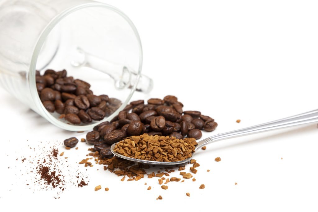 macro shot instant granules beans coffee white background