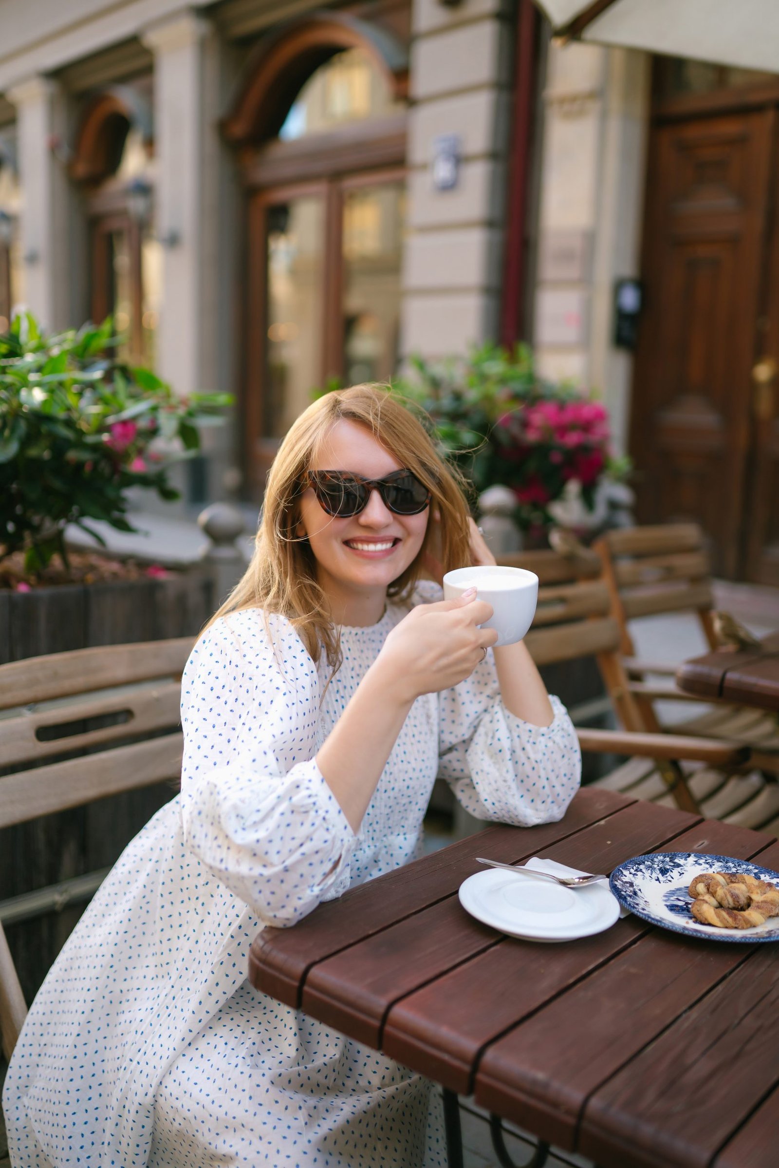 tourist woman enjoys architecture city streets with cup coffee travel vacation concept scaled